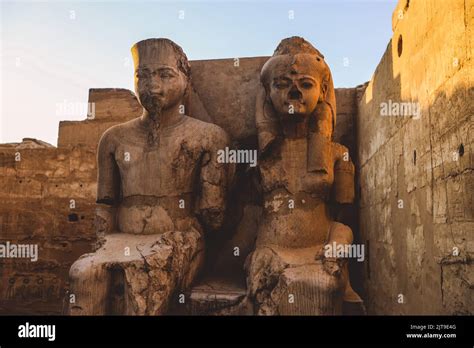 Ancient Egyptian Ruins Of God Statues Near The Pylon Of Luxor Temple