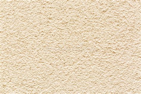 Sample Of A Texture Of Beige Plaster Wall Finished With A Decorative