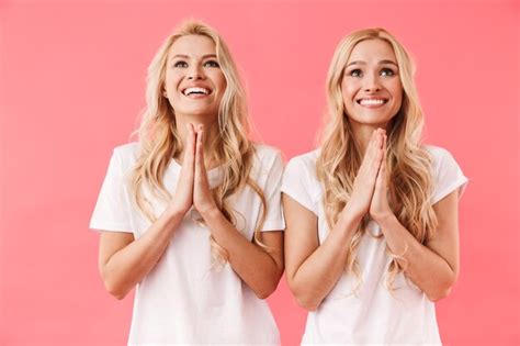 Premium Photo Smiling Blonde Twins Wearing In T Shirts Praying Together With Pray Gestures