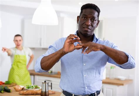 Man Taking Off Wedding Ring During Quarrel With Wife Stock Image