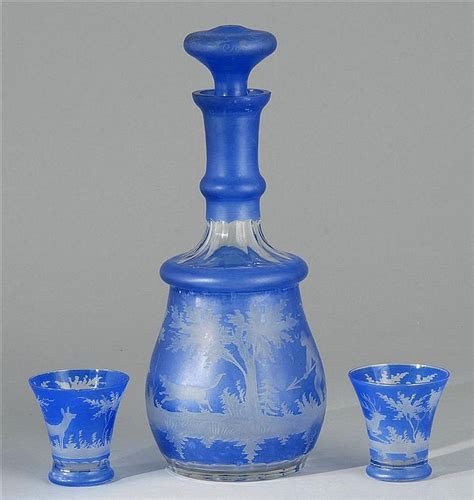 Lot Bohemian Cut Glass Decanter Set With Two Matching Cordials In Blue Cut Overlay Depicting