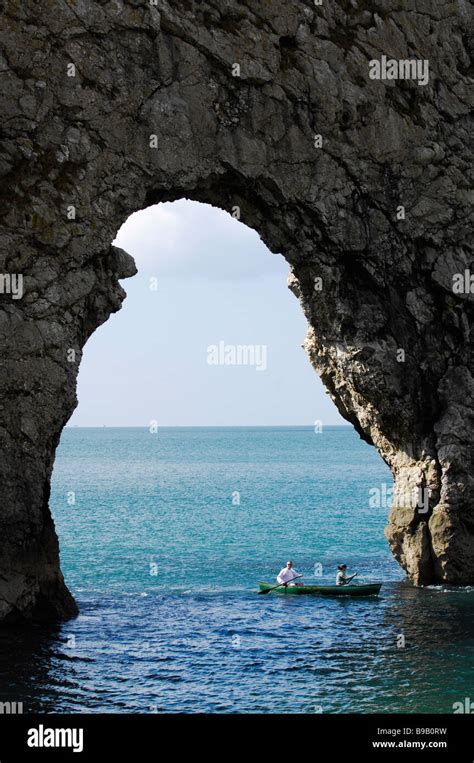 Durdle Door Arch And Boat Stock Photo Alamy
