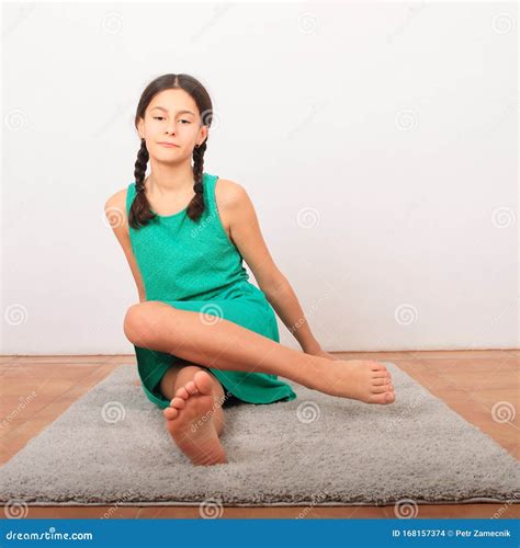 Tween Girl Sitting Barefoot