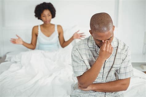 Premium Photo Upset Man Sitting On Bed After Arguing With His Girlfriend