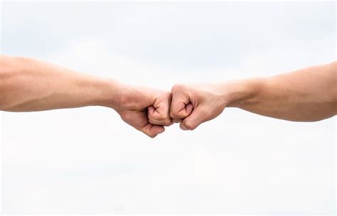 Premium Photo Fist Bump Clash Of Two Fists Concept Of Confrontation