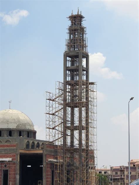 A New Mosque Under Construction Against The Sunny Blue Sky With The