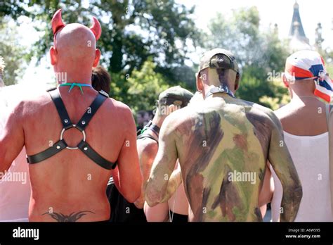 Two Near Naked Men Watching The Gay Pride Parade Brighton Uk Stock Photo Alamy