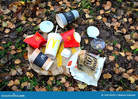 Discarded Paper Coffee Cups Cola And Fast Food Packaging On The Ground