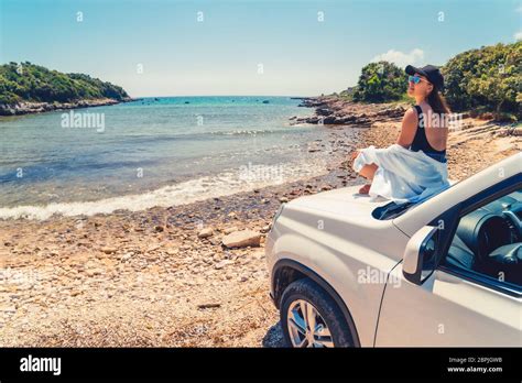 Woman Laying At Car Hood With View Of Sea Summer Beach Stock Photo Alamy