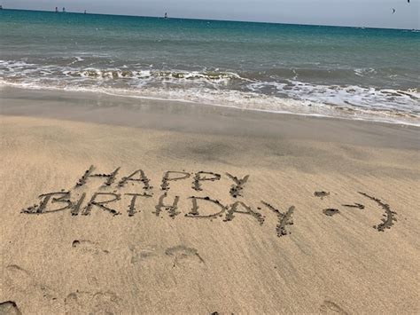 Premium Photo Text On Sand At Beach Against Sky