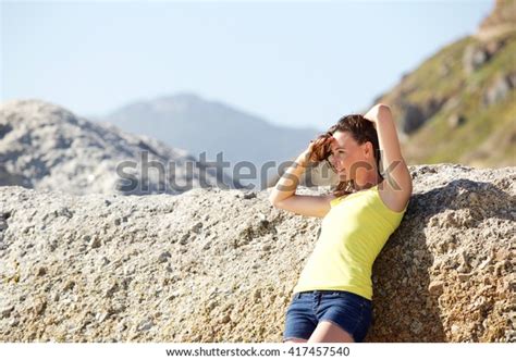 Portrait Attractive Young Woman Leaning Rock Stock Photo 417457540