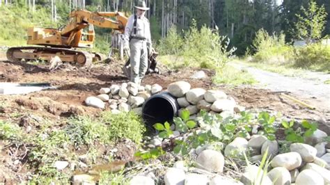 Building a Rock Headwall for Culvert in Three Minutes... - YouTube