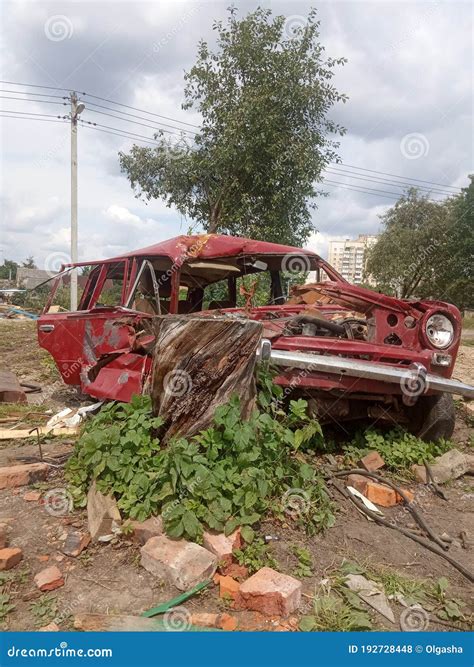 Old Broken Red Car Crashed And Abandoned Car After An Accident Stock