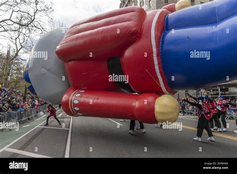 Handlers Struggle To Keep The Nutcracker Giant Balloon Low Because Of High Wind At 93rd Annual