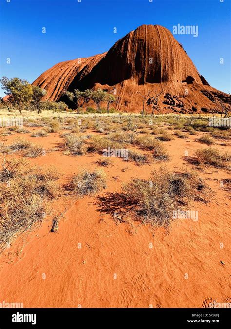 Uluru Or Ayers Rock Is A Massive Sandstone Monolith In The Heart Of