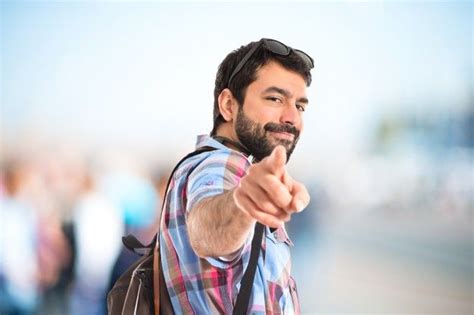 Free Photo Tourist Pointing Front