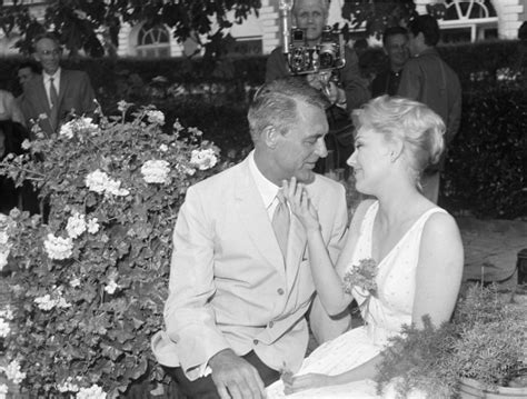 Kim Novak Strokes The Chin Of Cary Grant At A Party At The Cannes Film