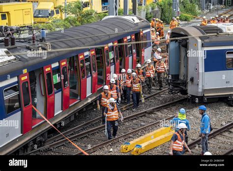 Mtr Workers Are Seen Walking Pass A Derailed Mtr Passengers Train Near