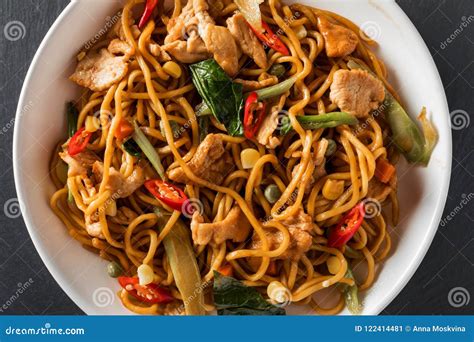 Wok Stir Fry Egg Noodles With Fried Chicken And Thai Spices Stock Image