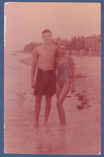 Guy And Girl On The Beach Hugging Bare Torso Swim Trunks Bikini