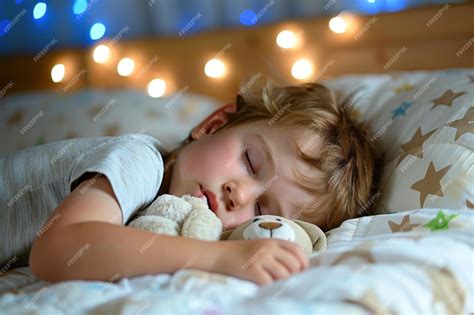 A Serene Slumber Scene Featuring A Child Sleeping With A Soft Toy Under