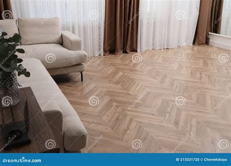 Modern Living Room With Parquet Flooring And Stylish Furniture Stock