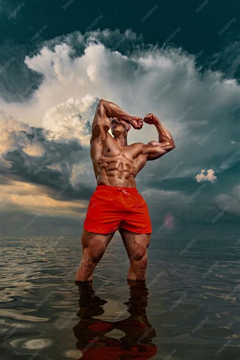 Premium Photo Fit Athlete Bodybuilder On The Beach Attractive Young