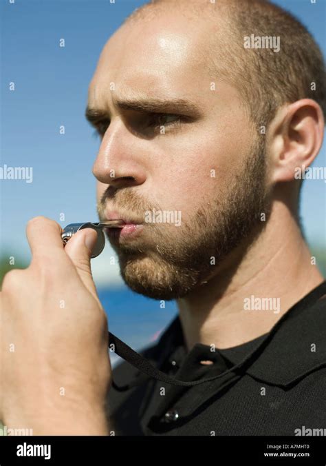 A Referee Blowing A Whistle Stock Photo Alamy