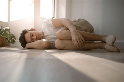 Premium Photo Sad And Depressed Man Hugging Himself Down On The Floor