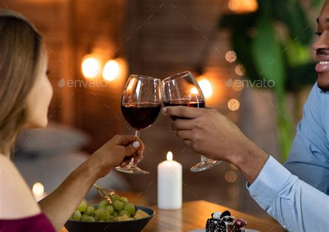 Toast For Love Affectionate Interracial Couple Clinking Wine Glasses