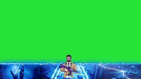 A Man Standing In Front Of A Green Screen With His Arms Wrapped Around