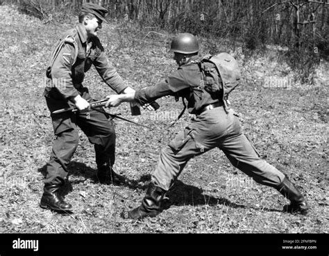 Two soldiers practice military hand-to-hand combat. [automated ...