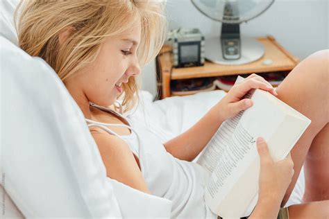 Girl Reading Book At Home By Stocksy Contributor Vera Lair Stocksy