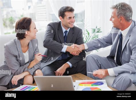 Cheerful Business People Agreeing On Contract Stock Photo Alamy