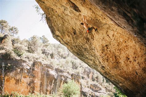 Climber in safety harness climbing mountain Stock Photo | Adobe Stock