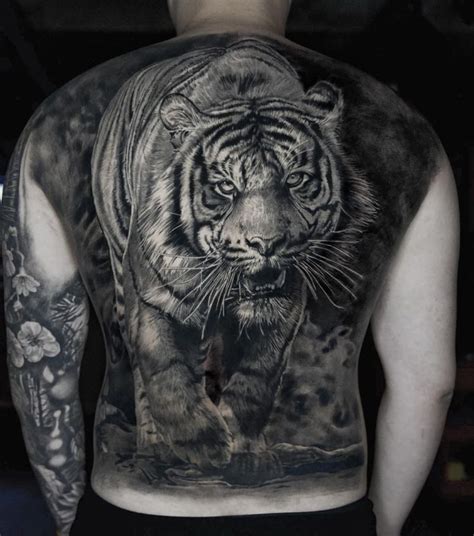 Share 68+ tiger spine tattoo best - in.coedo.com.vn