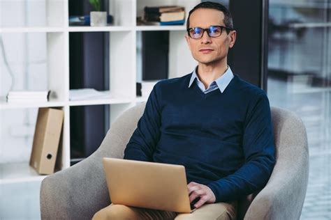 Premium Photo Man Wearing Glasses Working On Laptop Computer And