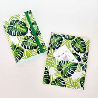 Two Small Notebooks With Green Leaves On Them