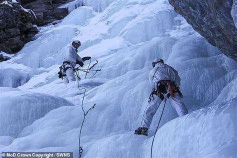 Action Men Royal Marine Commandos Perform Daring Parachute Jump Onto A