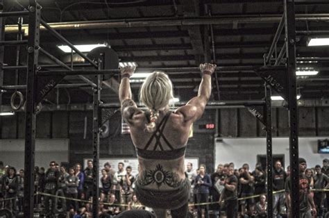 A Woman Standing On Top Of A Wrestling Ring