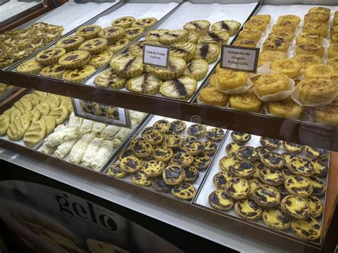 Pasteis De Nata And Traditional Pastries On Sale In A Lisbon Bakery