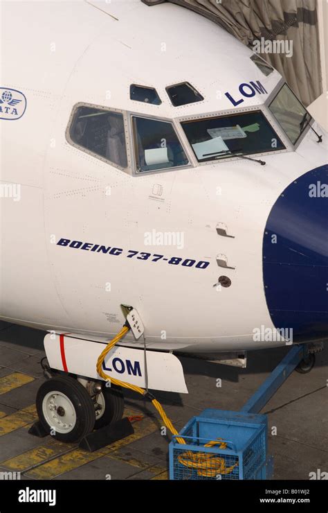 Boeing 737 airline nose section and cockpit close up detail at airport ...