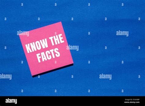 Know The Facts Message Written On Pink Paper With Blue Background