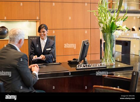 Businessman Woman Sitting Reception Desk Hi Res Stock Photography And