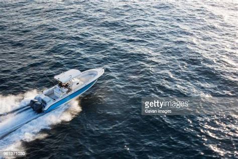 69 Man Driving Speed Boat Wearing White Outfit Stock Photos High Res