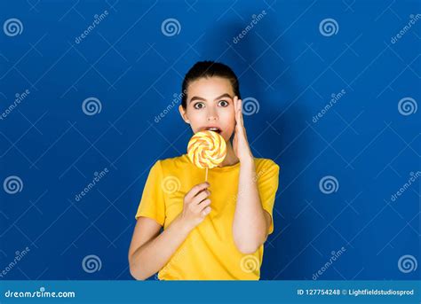 Beautiful Surprised Brunette Girl Holding Lollipop Stock Photo Image