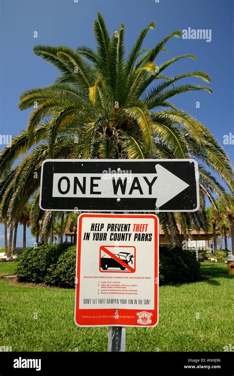 One Way And Theft Prevention Sign In Sand Key Park Clearwater Florida