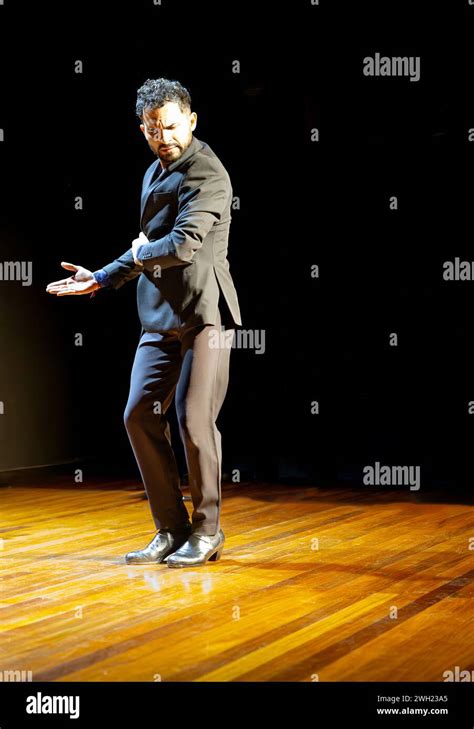 Focused Male Flamenco Dancer On Stage Showcasing A Traditional Dance