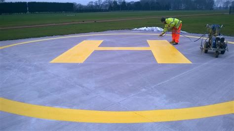 Our Operative Marking Out A Helicopter Landing Pad Floor Graphics