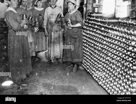 Industry During The First World War Female Workers Hold Shells They Are